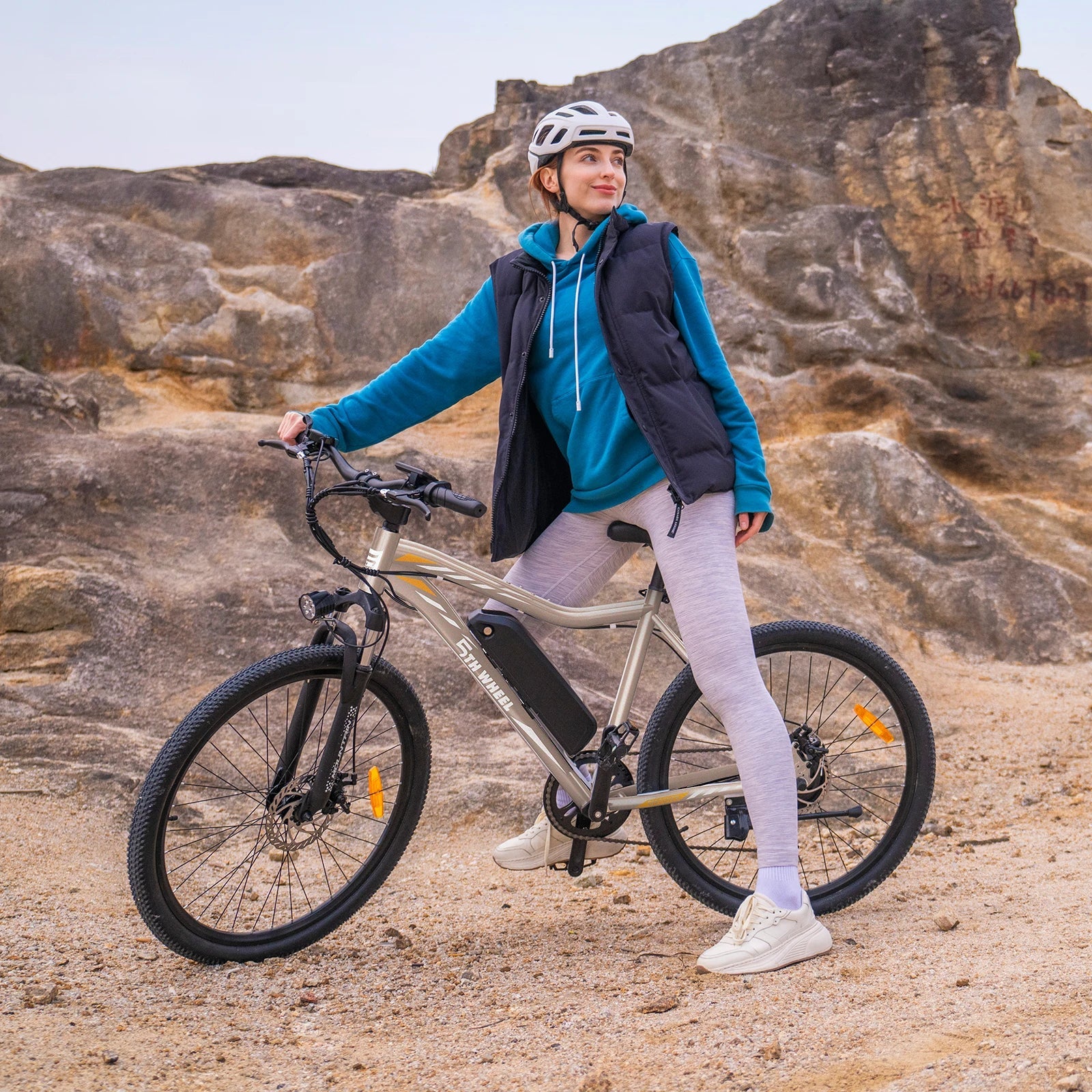 Man on bike with mountain behind him